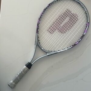 Prince Attacked 24 Childs tennis racket. Color purple, black and white.